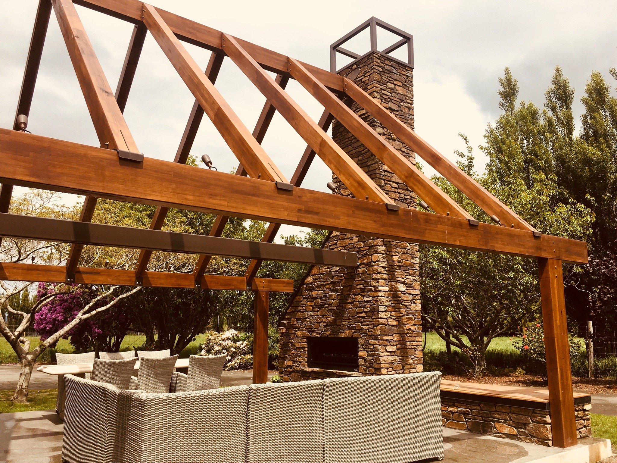 Weather-protected outdoor kitchen with cooking and preparation space