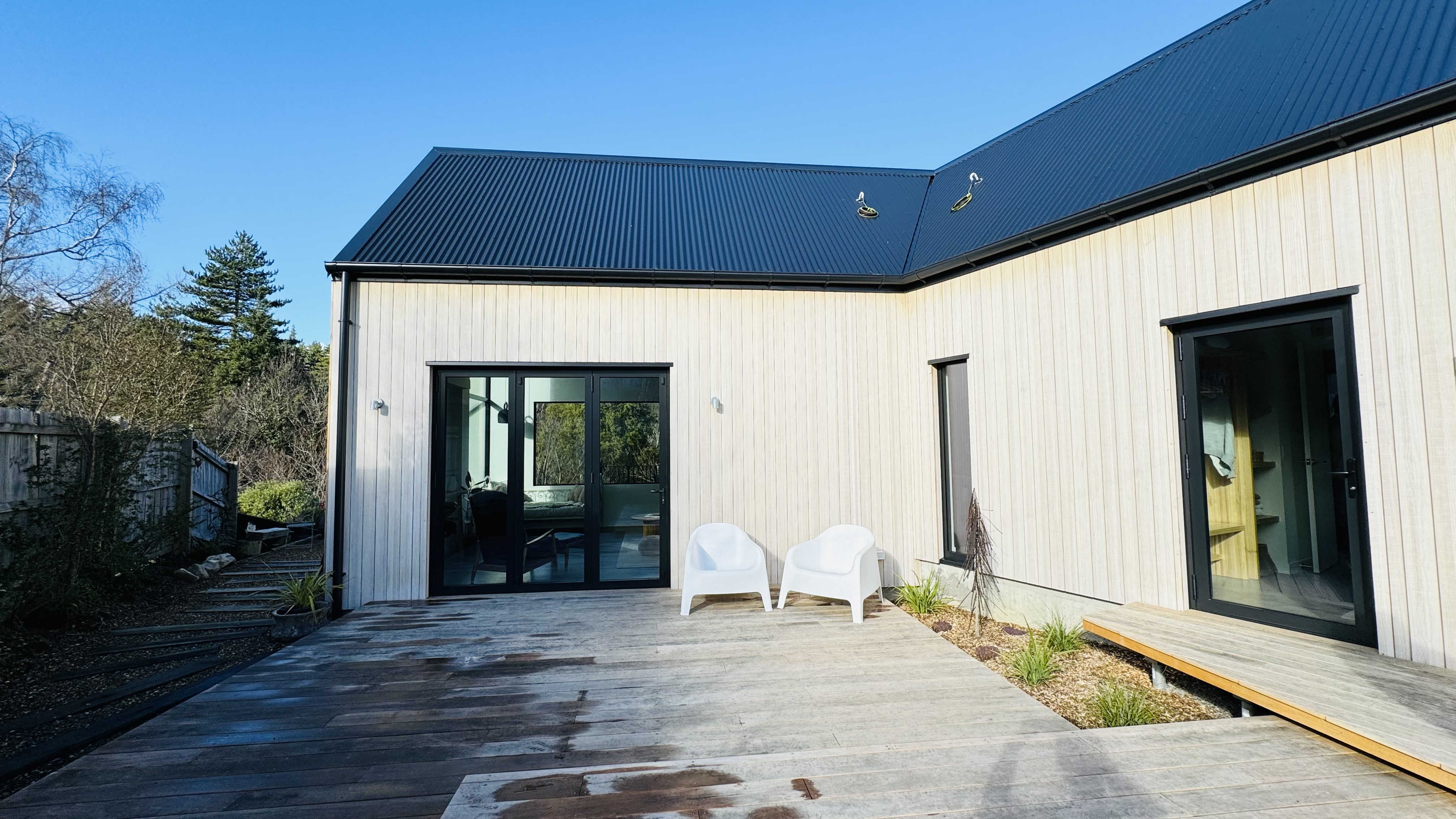 Drone aerial view of Hanmer holiday home integrated into hillside terrain
