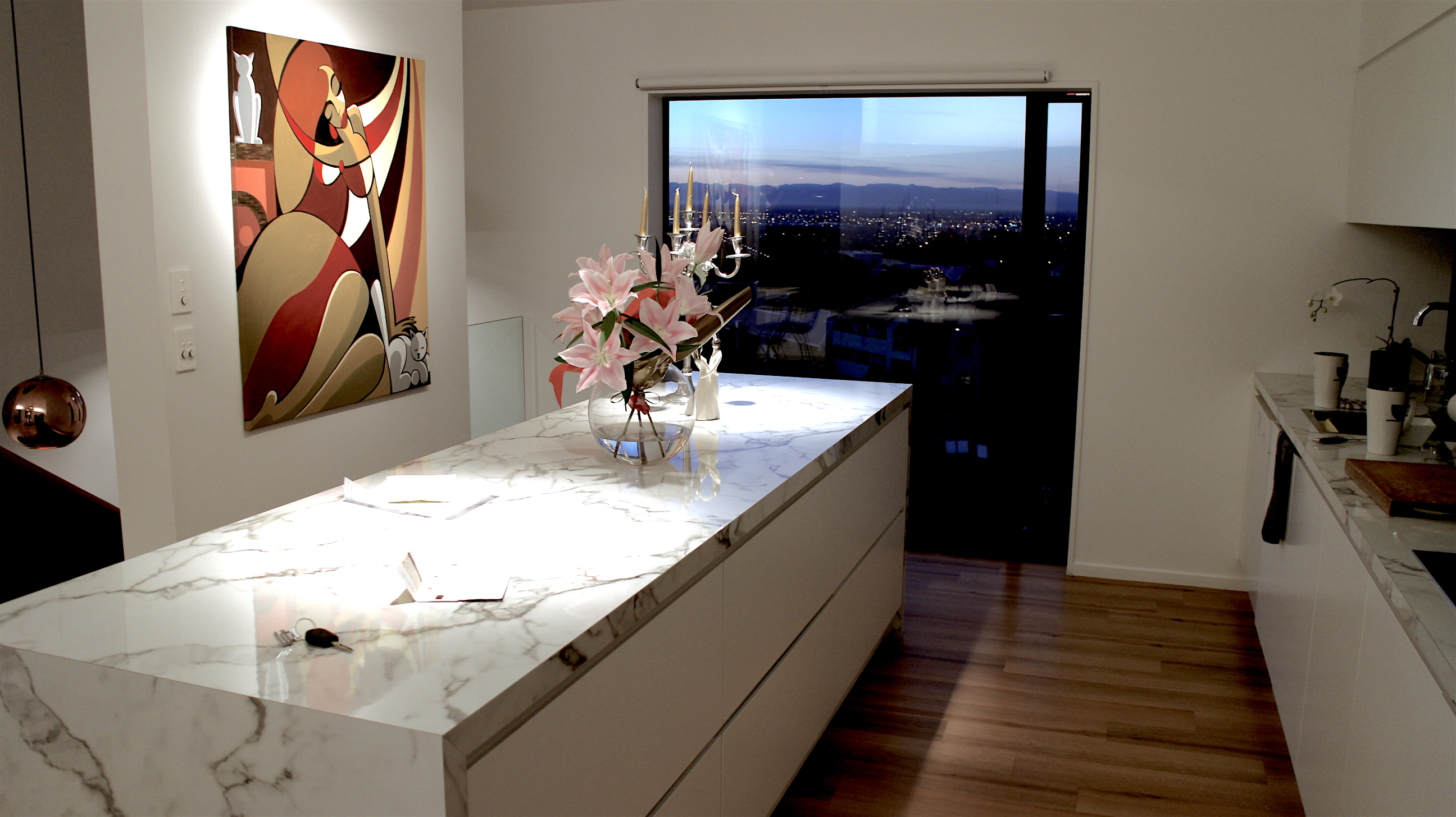 Twilight exterior with warm interior lighting through thermally broken glazing